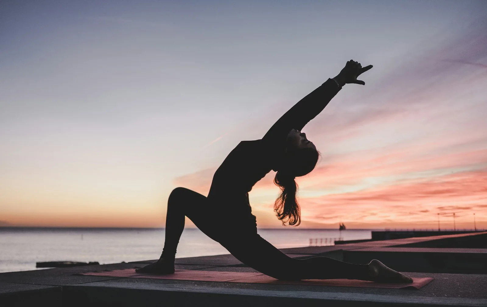 Outdoor yoga in the warm light of sunrise